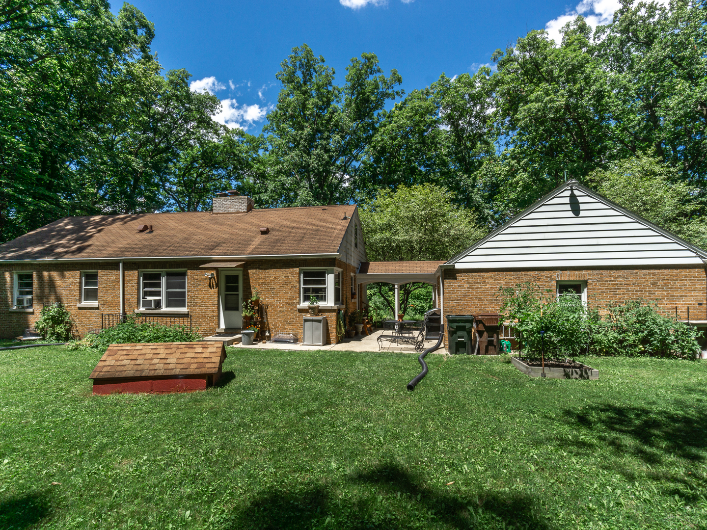 5415 West Pauling Road Monee, IL 60449 - Photo 4 of 17 a front view of a house with a yard table and chairs