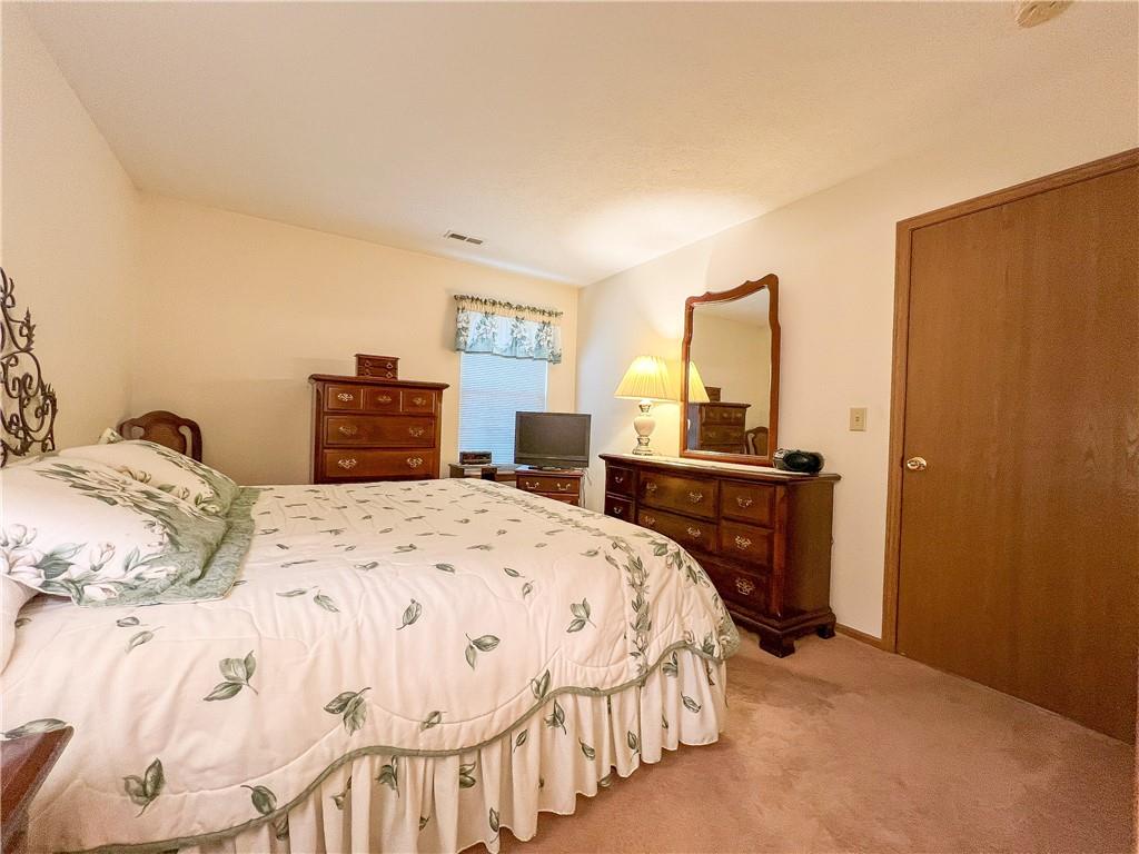 104 Brookstone Court Butler, PA 16001 - Photo 13 of 34 a bedroom with a bed and a dresser