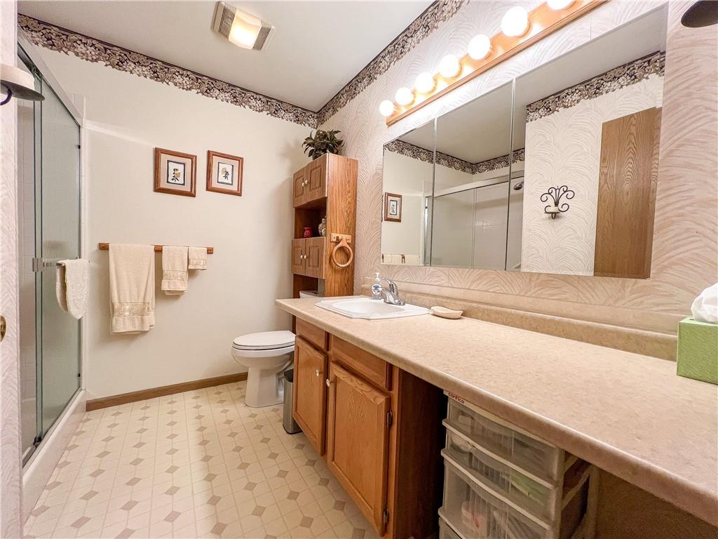 104 Brookstone Court Butler, PA 16001 - Photo 15 of 34 a bathroom with a sink a toilet and shower