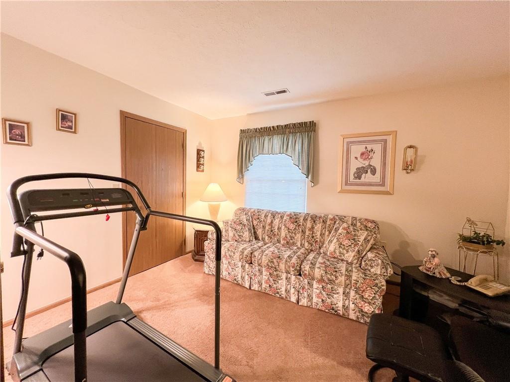 104 Brookstone Court Butler, PA 16001 - Photo 16 of 34 a bedroom with a bed and a dresser with mirror