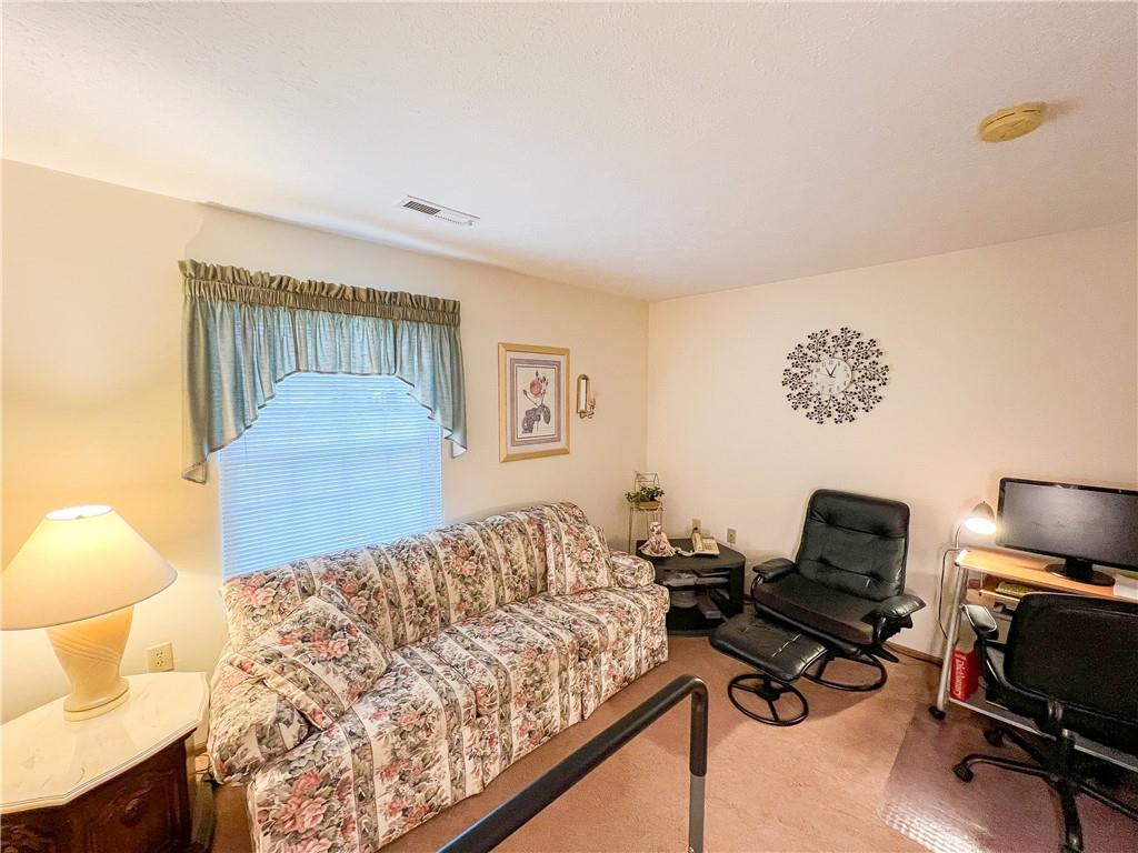 104 Brookstone Court Butler, PA 16001 - Photo 18 of 34 a bedroom with a bed a desk and chair