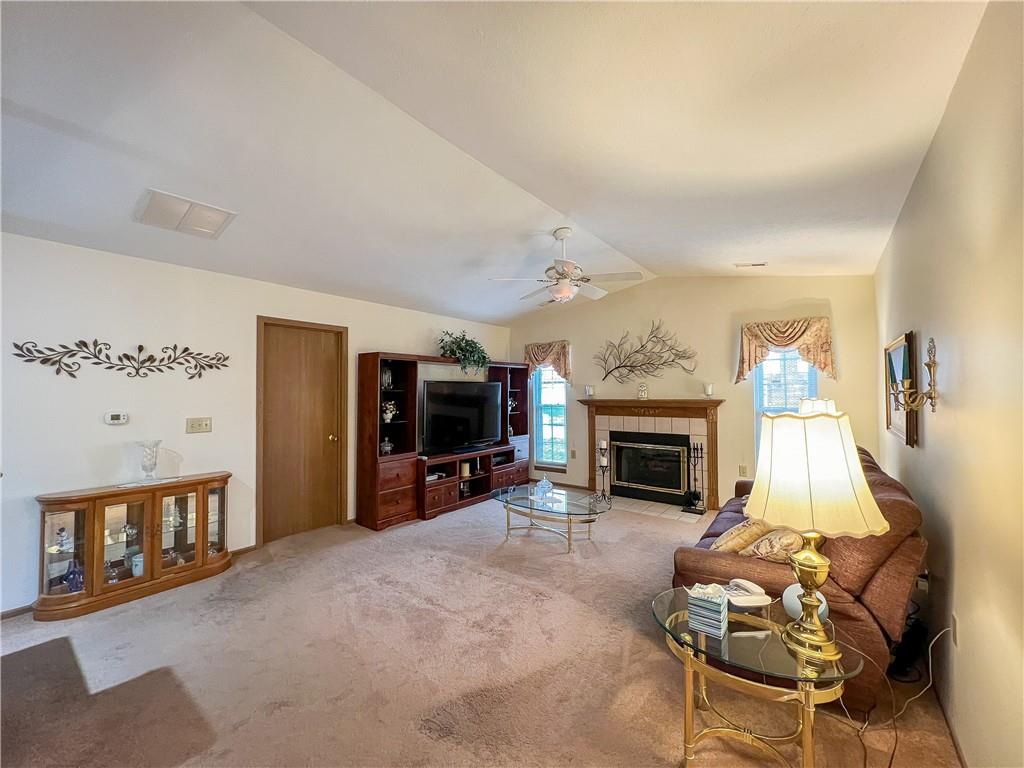 104 Brookstone Court Butler, PA 16001 - Photo 2 of 34 a living room with furniture a fireplace and a flat screen tv
