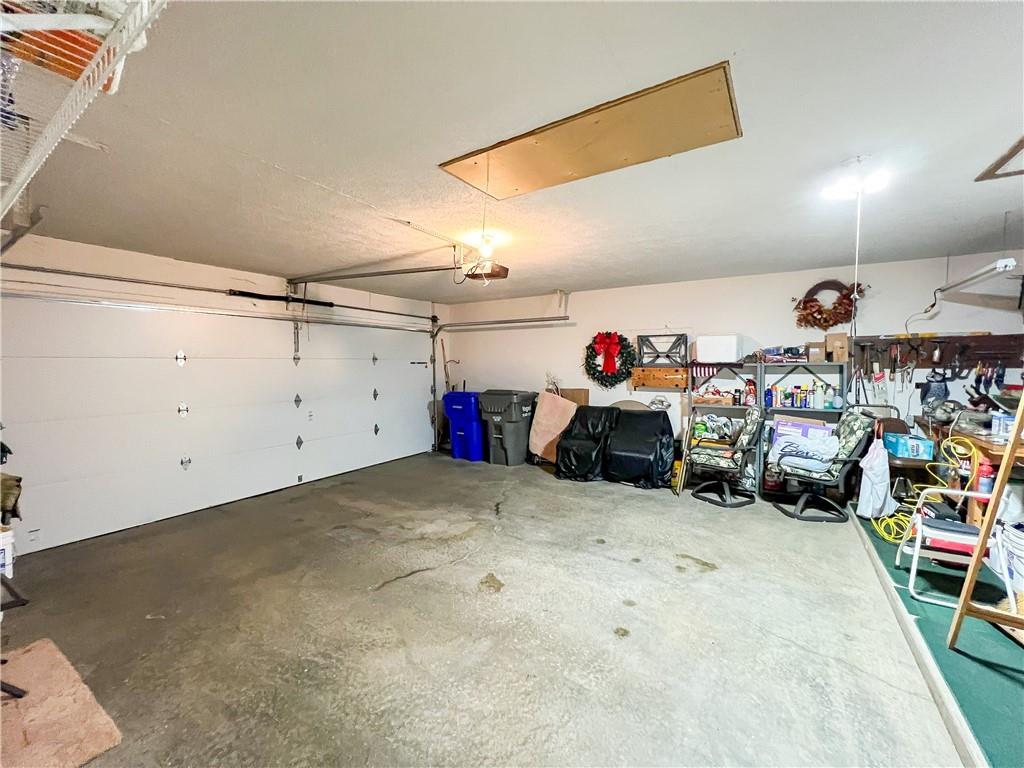 104 Brookstone Court Butler, PA 16001 - Photo 23 of 34 a view of a garage with a bike and white walls
