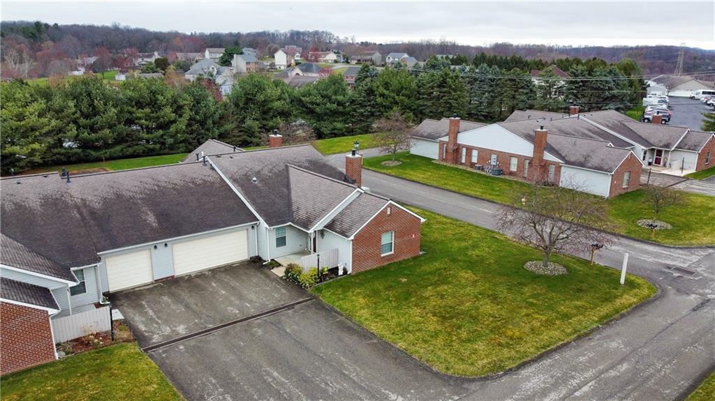 104 Brookstone Court Butler, PA 16001 - Photo 30 of 34 an aerial view of a house with a garden and a swimming pool