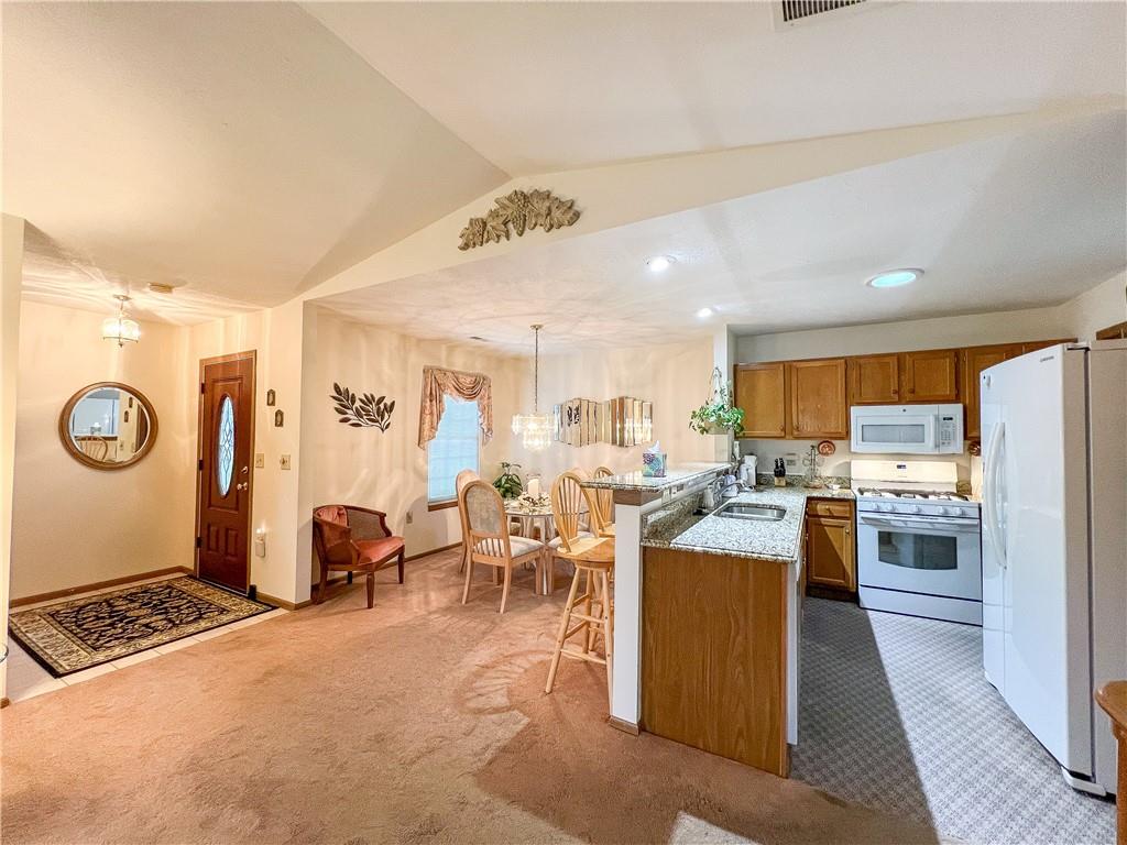 104 Brookstone Court Butler, PA 16001 - Photo 3 of 34 a living room with stainless steel appliances furniture and a kitchen view