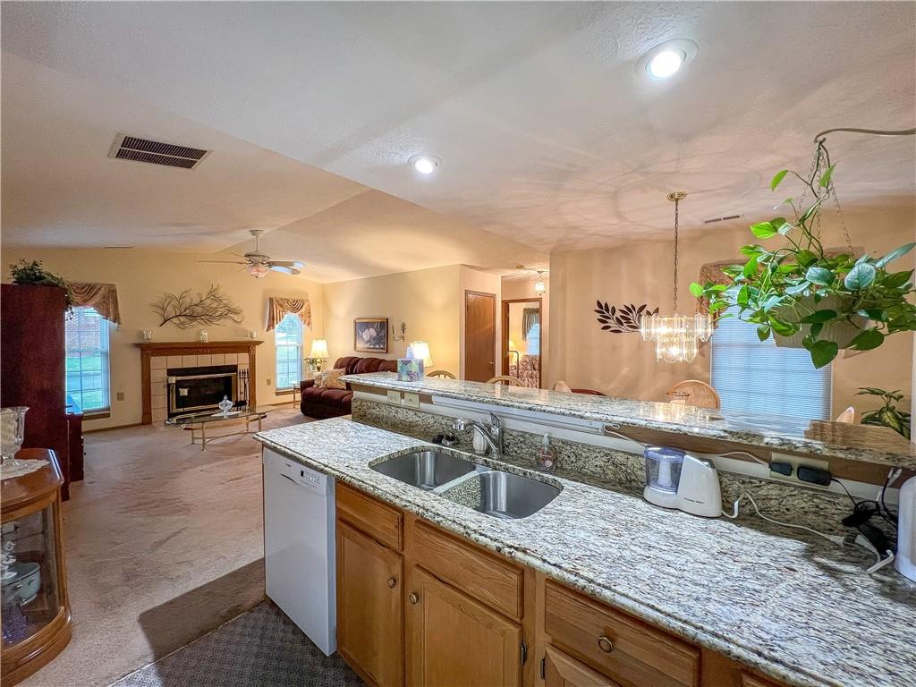 104 Brookstone Court Butler, PA 16001 - Photo 7 of 34 a kitchen with granite countertop a sink and a stove