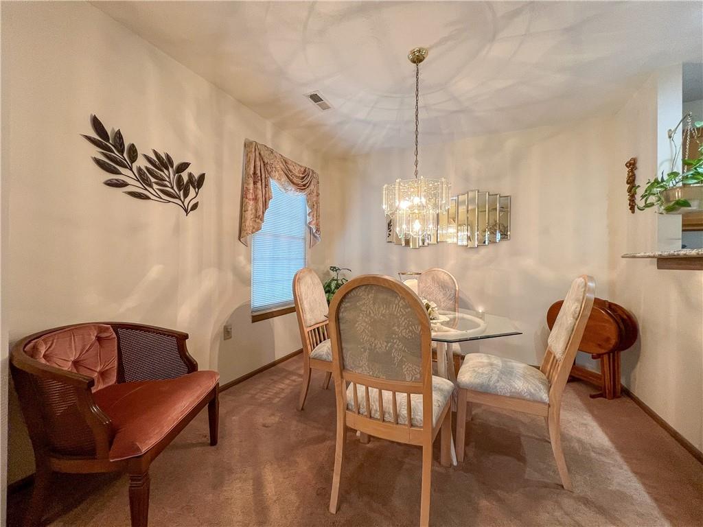 104 Brookstone Court Butler, PA 16001 - Photo 9 of 34 a view of a dining room with furniture and chandelier