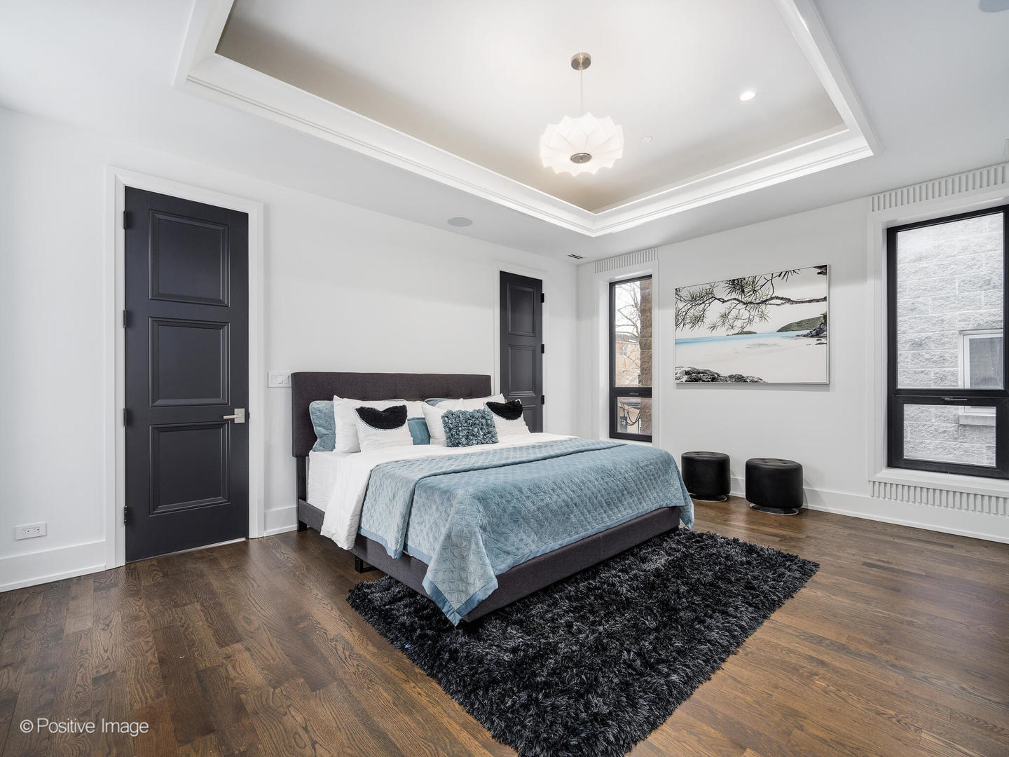 1216 West George Street Chicago, IL 60657 - Photo 16 of 42 a bedroom with a large bed and a window