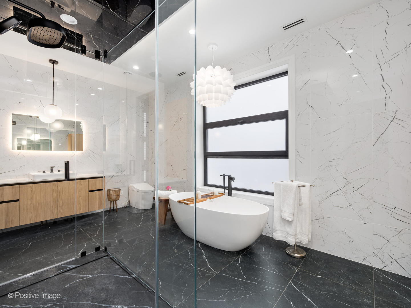 1216 West George Street Chicago, IL 60657 - Photo 17 of 42 a spacious bathroom with a double vanity sink a mirror and bathtub