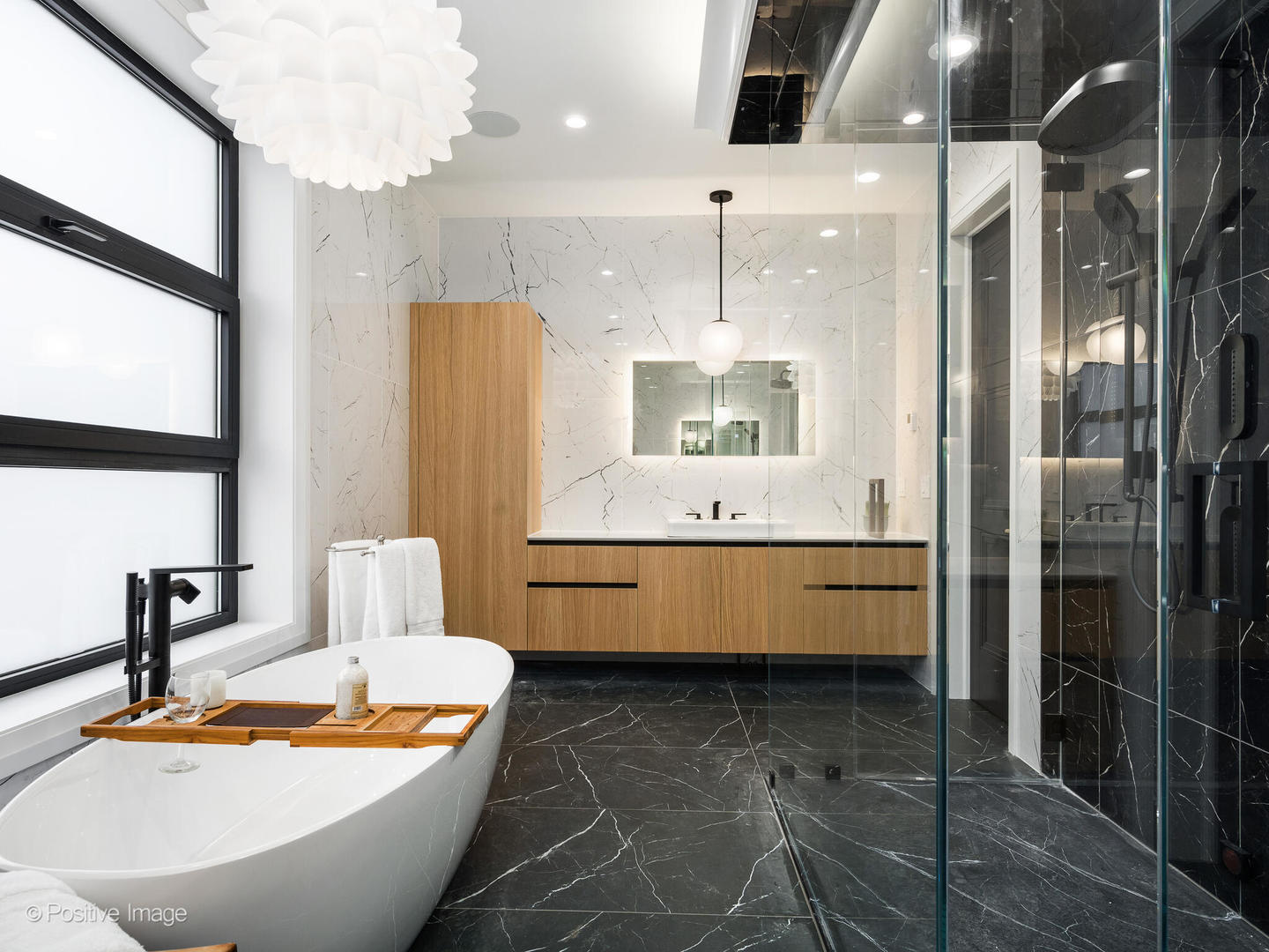 1216 West George Street Chicago, IL 60657 - Photo 18 of 42 a bathroom with a tub a sink and a mirror