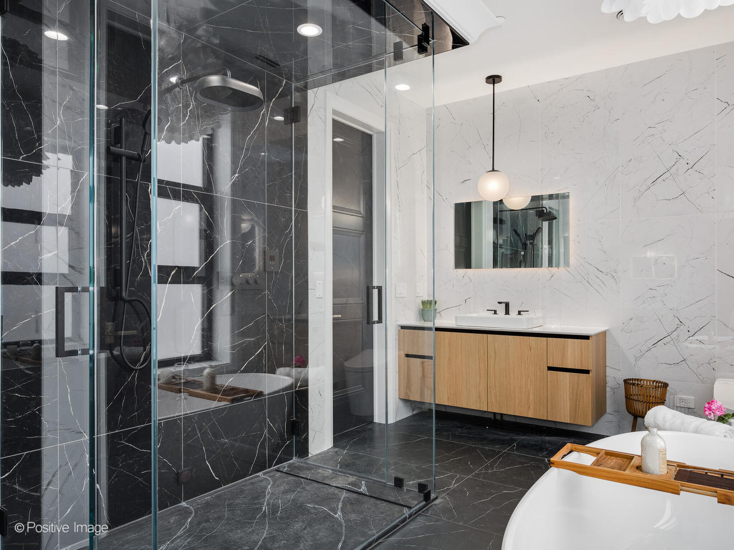 1216 West George Street Chicago, IL 60657 - Photo 20 of 42 a spacious bathroom with a double vanity sink a mirror and shower