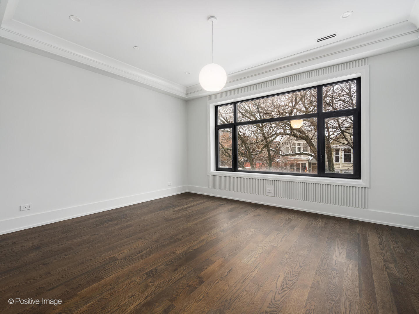 1216 West George Street Chicago, IL 60657 - Photo 23 of 42 wooden floor in an empty room with a window