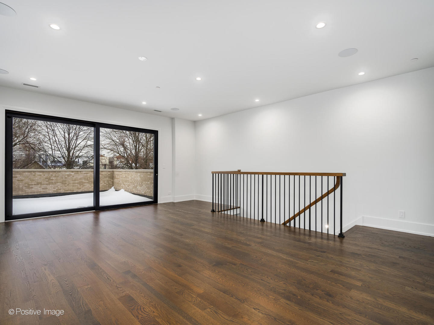 1216 West George Street Chicago, IL 60657 - Photo 25 of 42 a view of an empty room with wooden floor and a window
