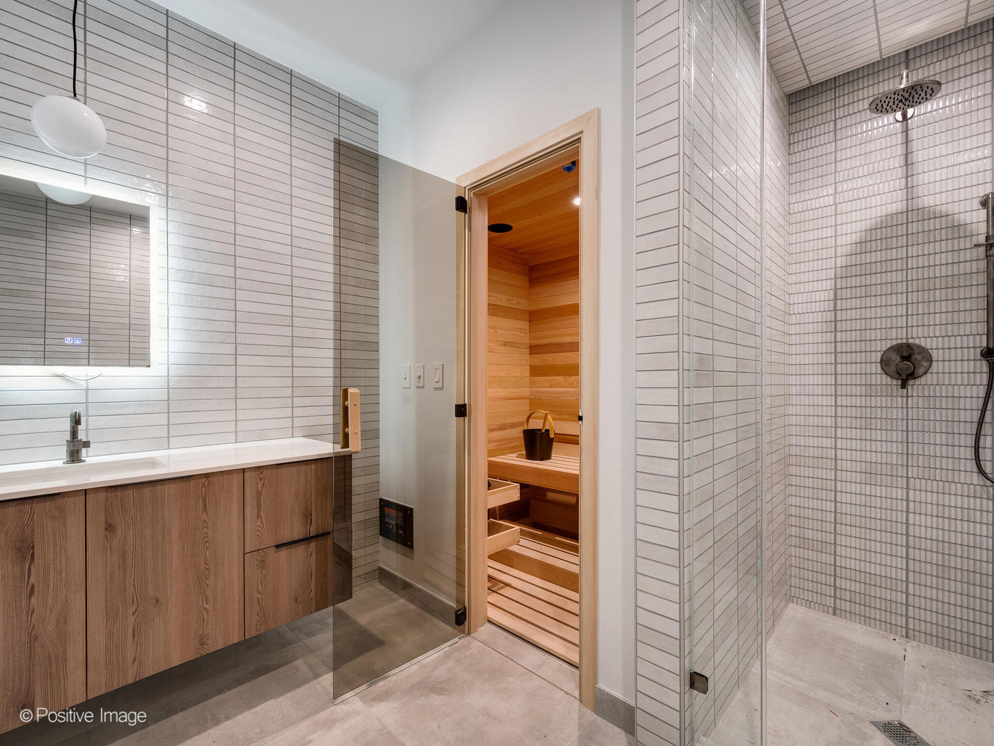 1216 West George Street Chicago, IL 60657 - Photo 32 of 42 a bathroom with a sink a mirror and shower