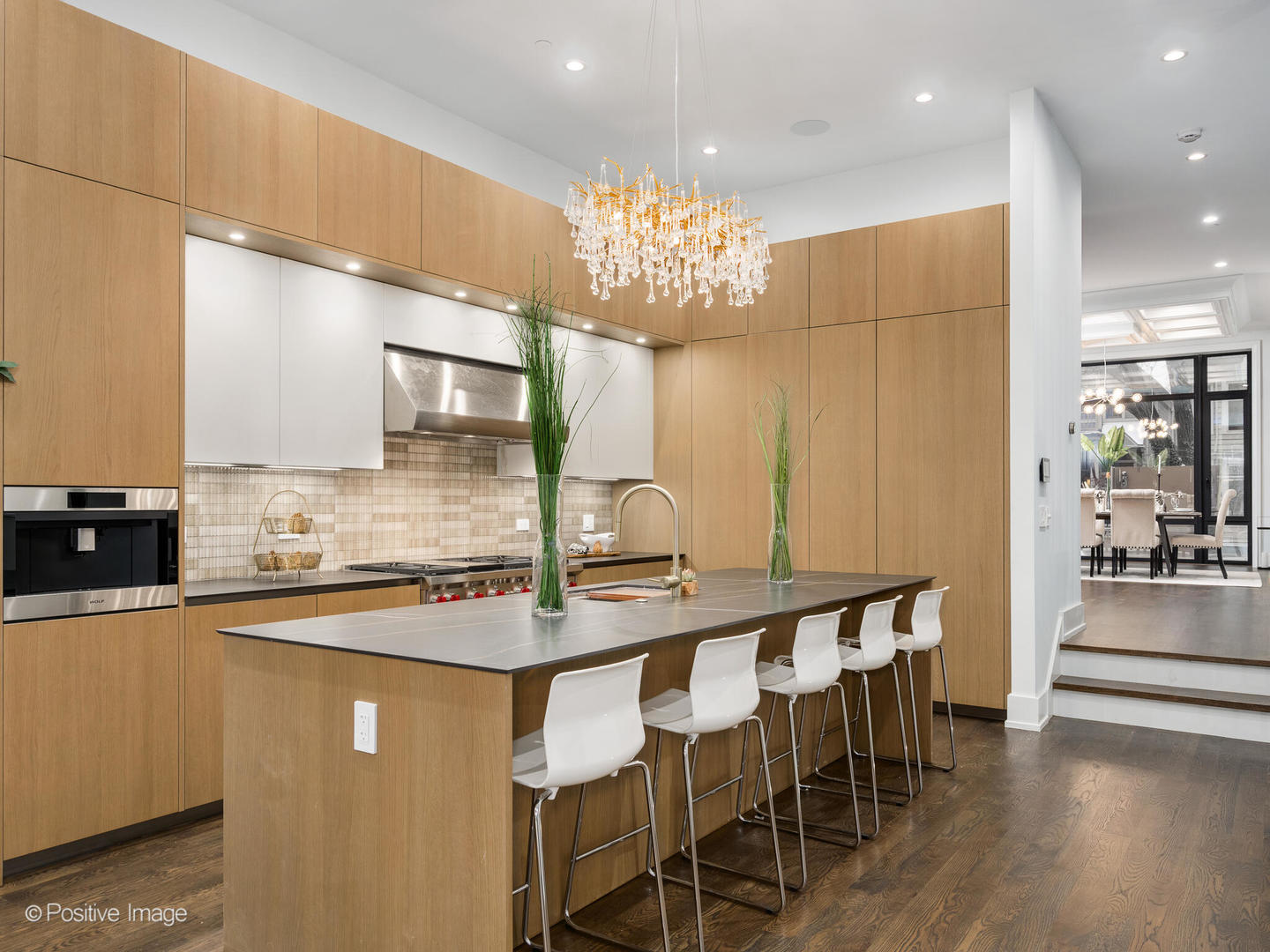 1216 West George Street Chicago, IL 60657 - Photo 8 of 42 a kitchen with stainless steel appliances granite countertop a stove top oven a sink dishwasher a dining table and chairs