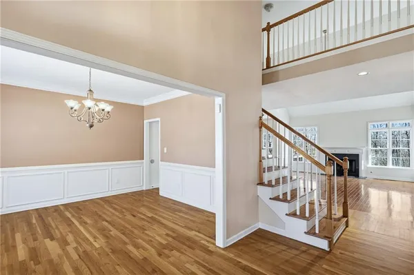 a view of an entryway with wooden floor