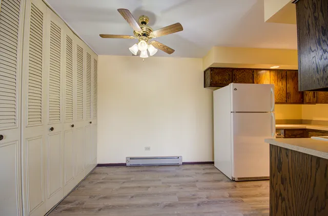 an empty room with wooden floor