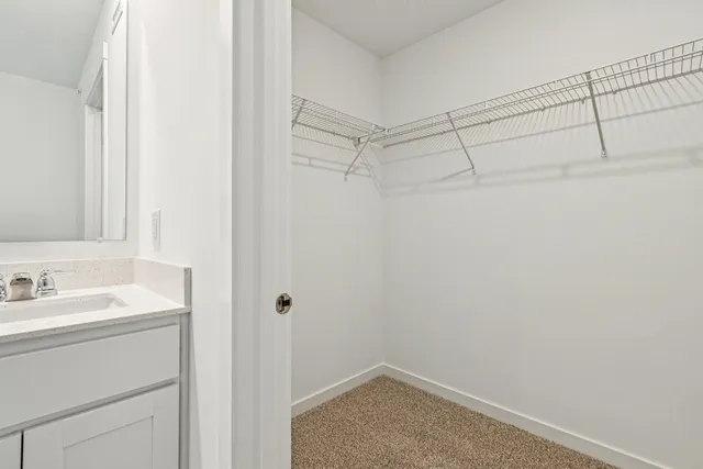 a bathroom with a sink and vanity