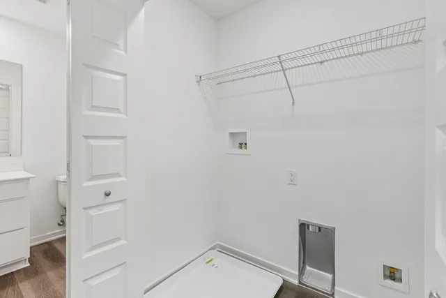 a view of walk in closet with empty racks