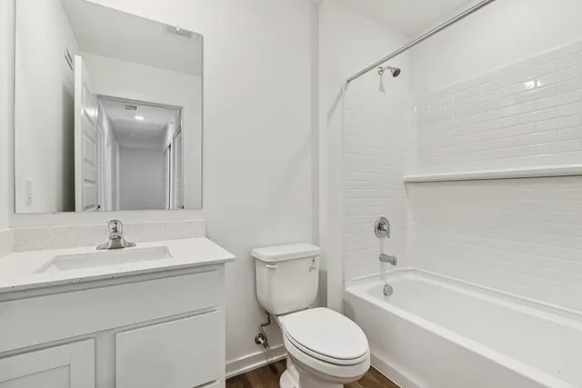 a bathroom with a sink a toilet and a bathtub