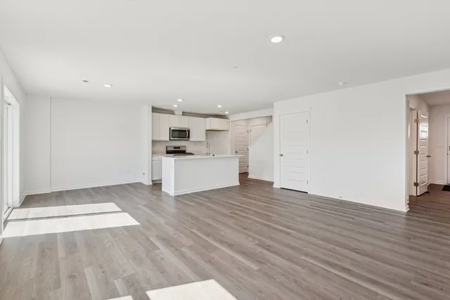 a view of kitchen with wooden floor
