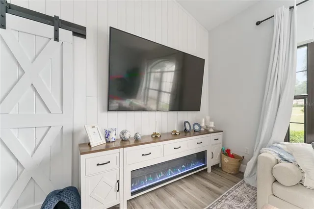 a large kitchen with a table and chairs