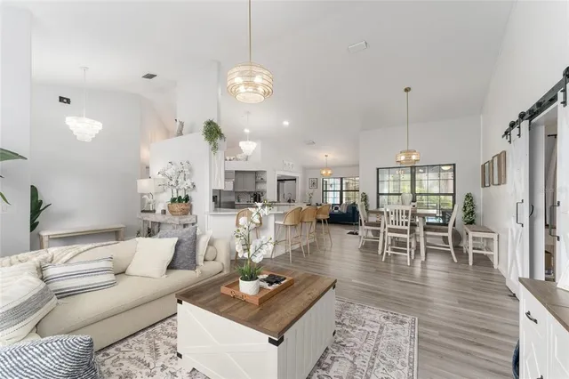 a large kitchen with a table and chairs