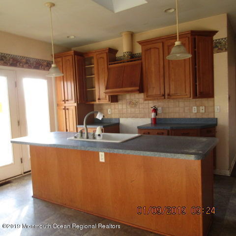 35 Holmes Mill Road Cream Ridge, NJ 08514 - Photo 2 of 7 a kitchen with a sink a counter top space and cabinets