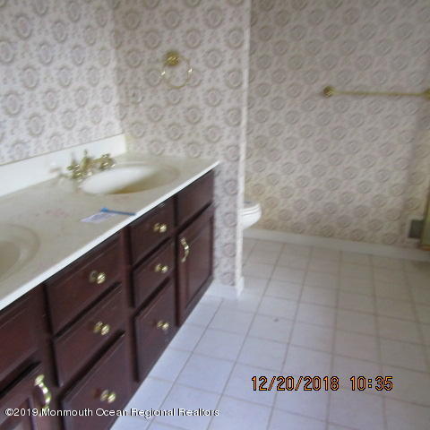 35 Holmes Mill Road Cream Ridge, NJ 08514 - Photo 6 of 7 a bathroom with a sink vanity and tub
