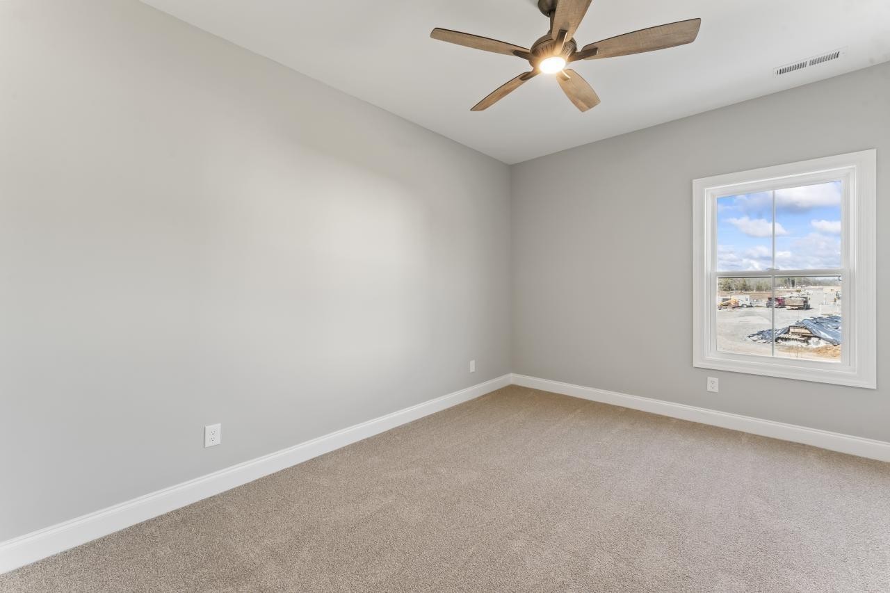 2134 Gracie Bug Loop Murfreesboro, TN 37128 - Photo 17 of 25 an empty room with a window and a fan