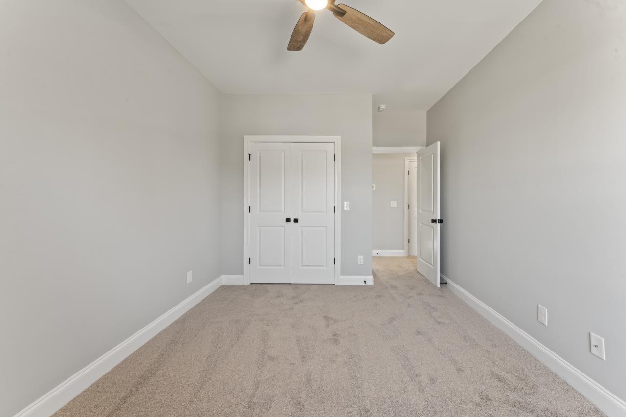 2134 Gracie Bug Loop Murfreesboro, TN 37128 - Photo 20 of 25 an empty room with chandelier fan