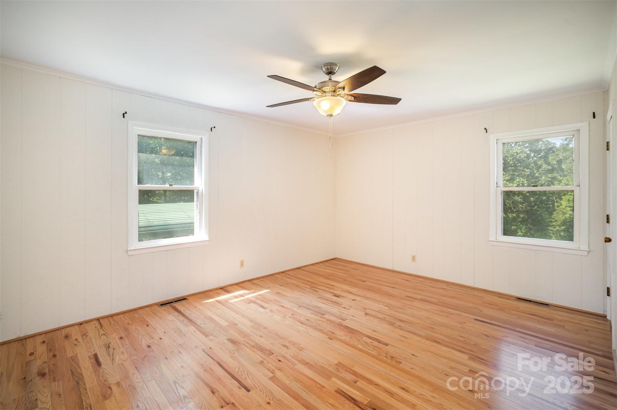 5474 Ussery Road Kershaw, SC 29067 - Photo 18 of 33 a view of empty room with wooden floor and fan