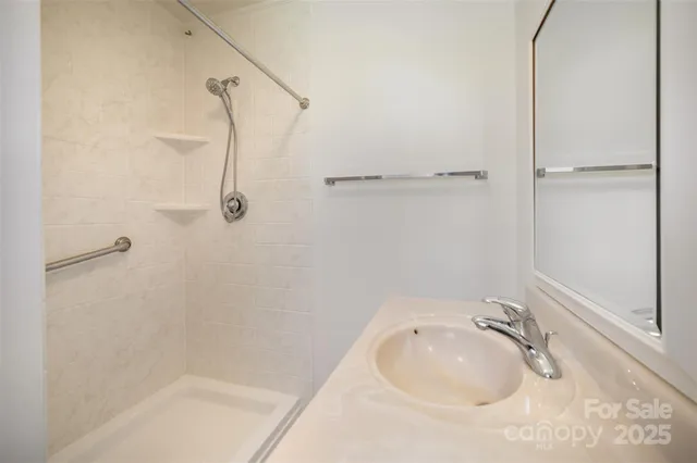 a bathroom with a sink and shower