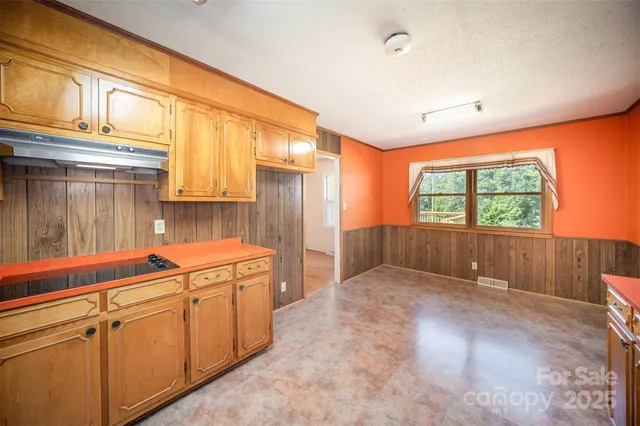 a view of a kitchen with storage and utility