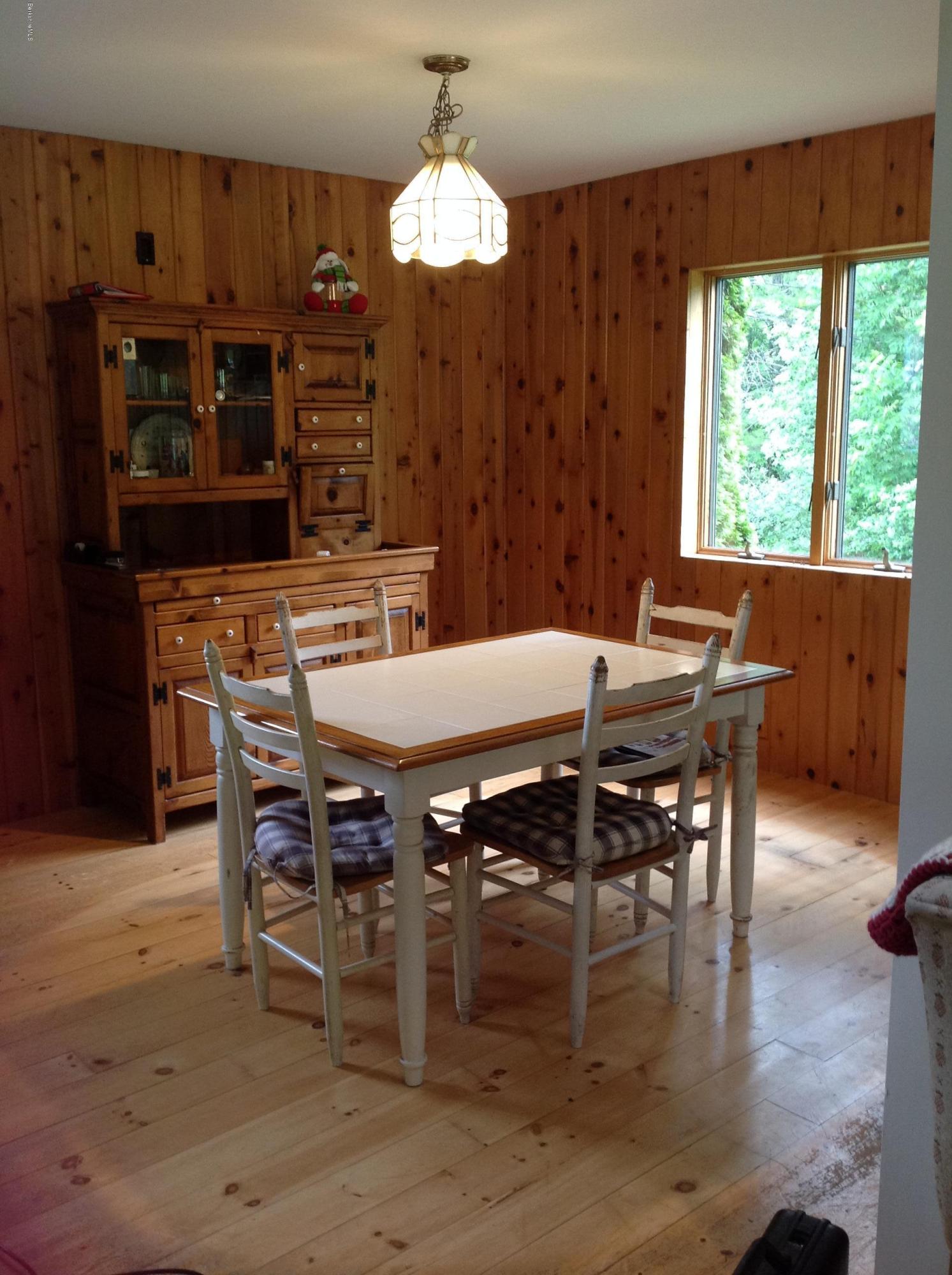 604 East Windsor Road Windsor, MA 01270 - Photo 19 of 28 a view of a dining room with furniture window and wooden floor