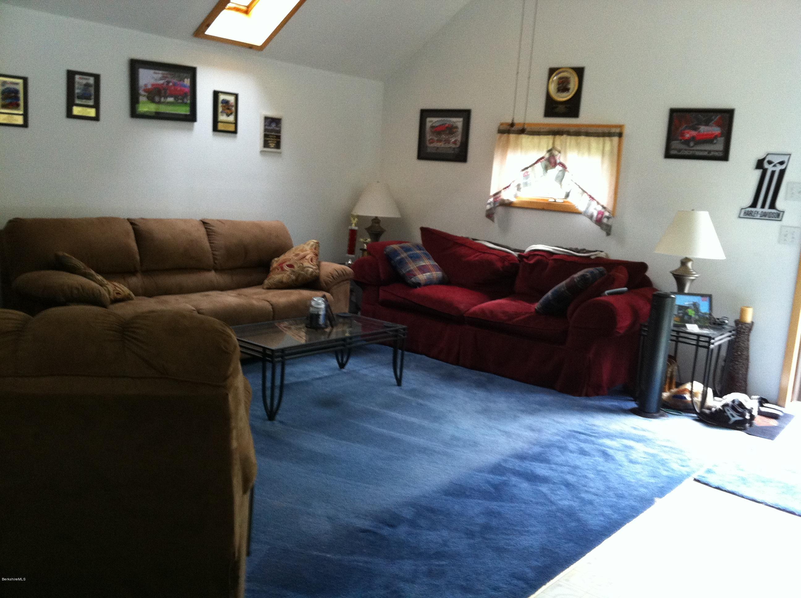 604 East Windsor Road Windsor, MA 01270 - Photo 28 of 28 a living room with furniture a couch and a flat screen tv