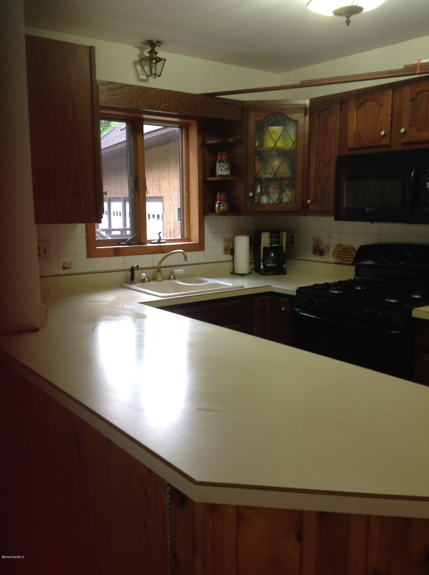 604 East Windsor Road Windsor, MA 01270 - Photo 9 of 28 a view of a kitchen with a window and a sink