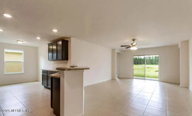 a kitchen with stainless steel appliances granite countertop a stove and a sink