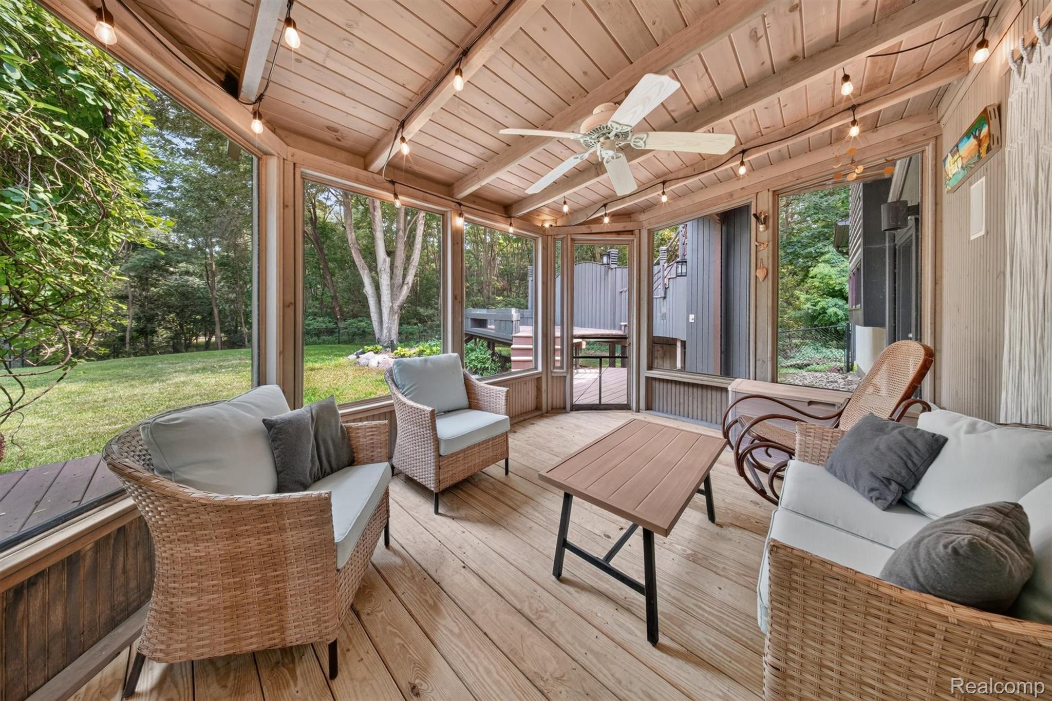 9319 Faussett Road Fenton, MI 48430 - Photo 46 of 70 Screened porch with wood-finish flooring, wood-paneled ceiling, and exposed wood beams