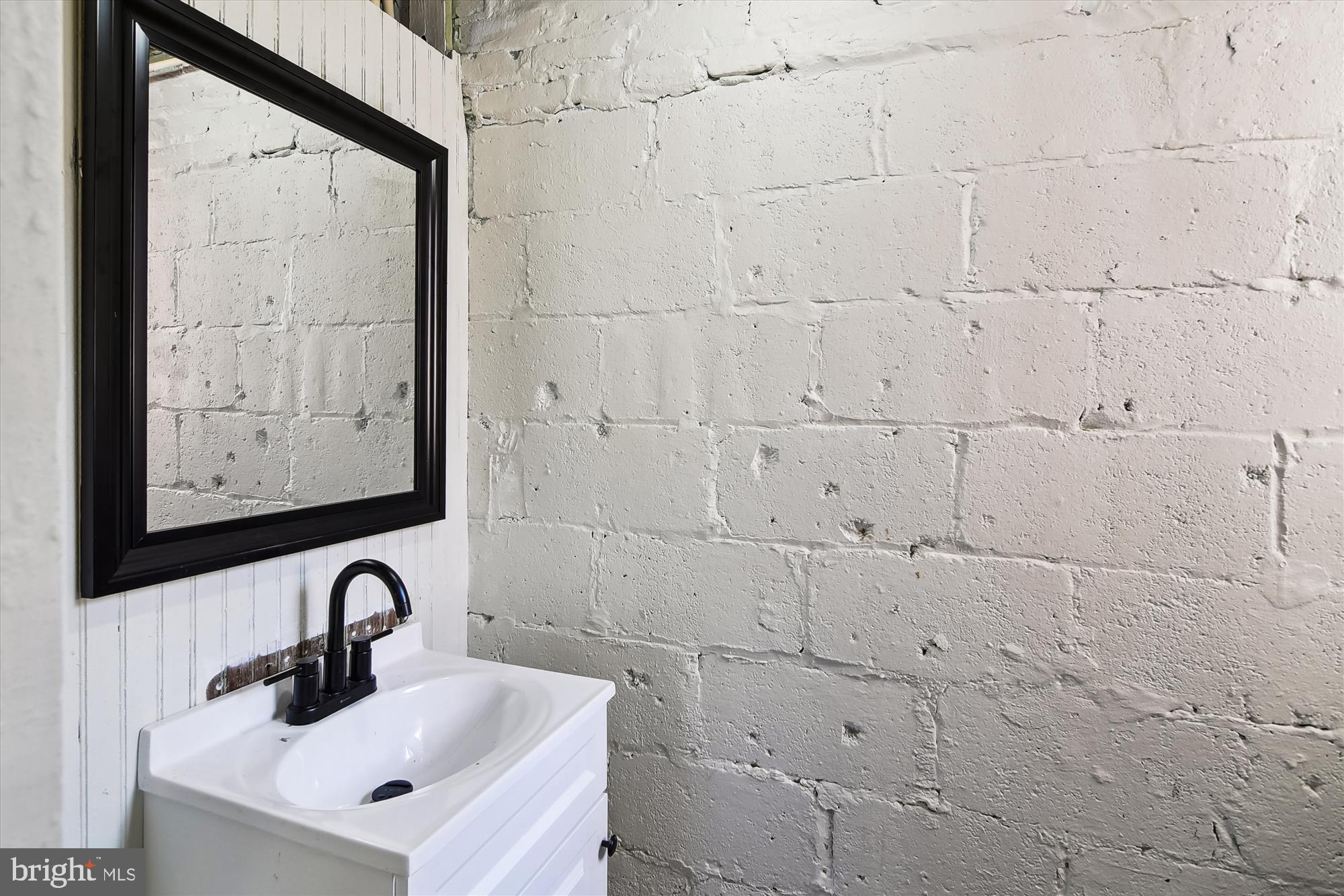 3312 Royce Avenue Baltimore, MD 21215 - Photo 15 of 20 a bathroom with sink and mirror