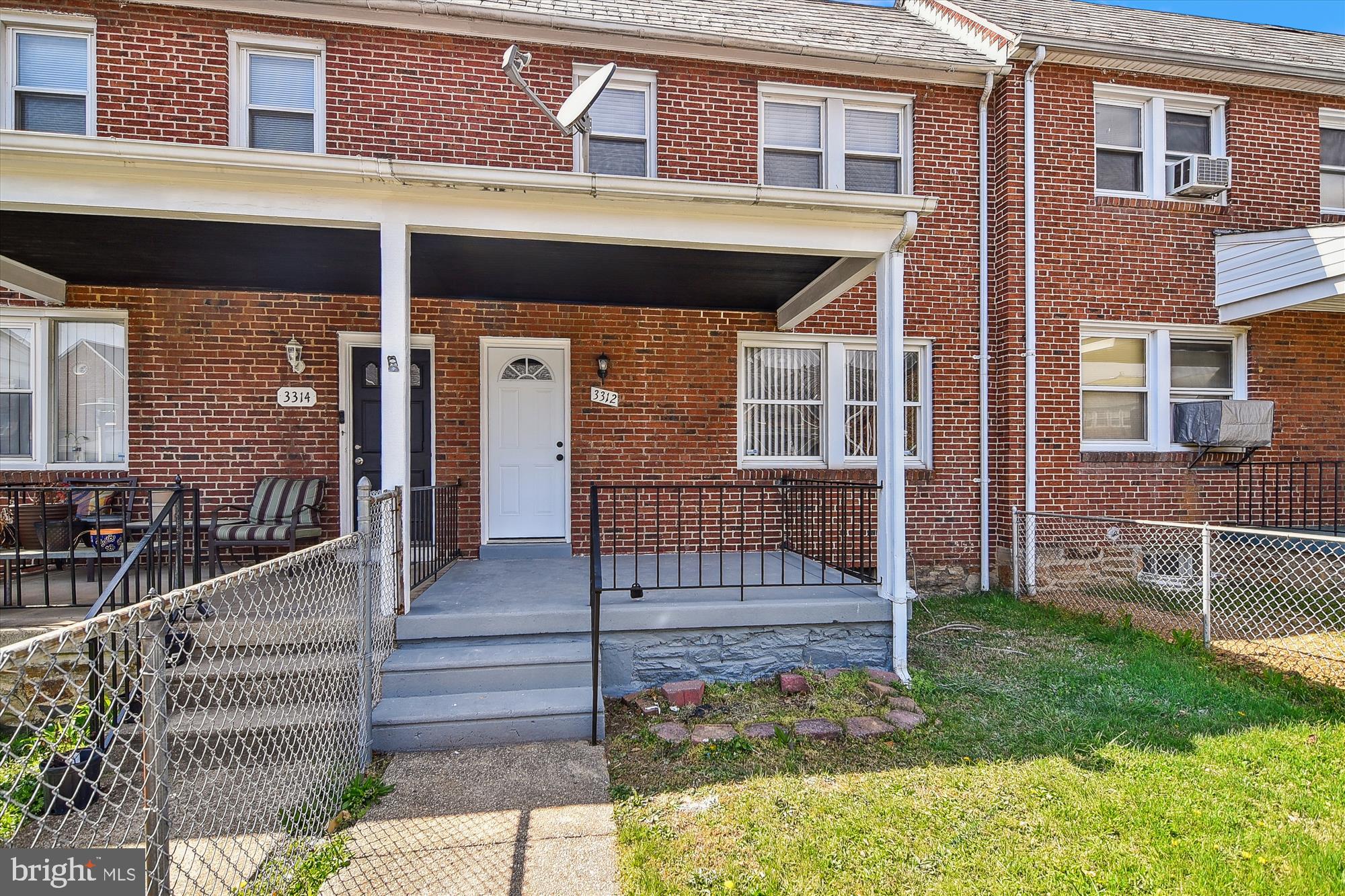 3312 Royce Avenue Baltimore, MD 21215 - Photo 20 of 20 a front view of a house with a yard