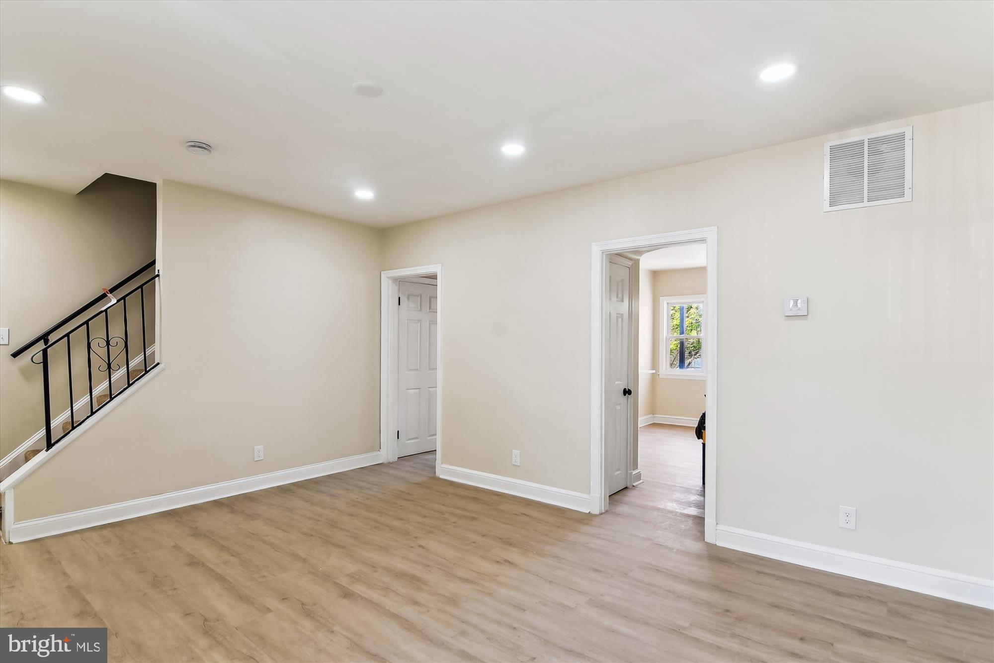 3312 Royce Avenue Baltimore, MD 21215 - Photo 3 of 20 a view of an empty room with wooden floor
