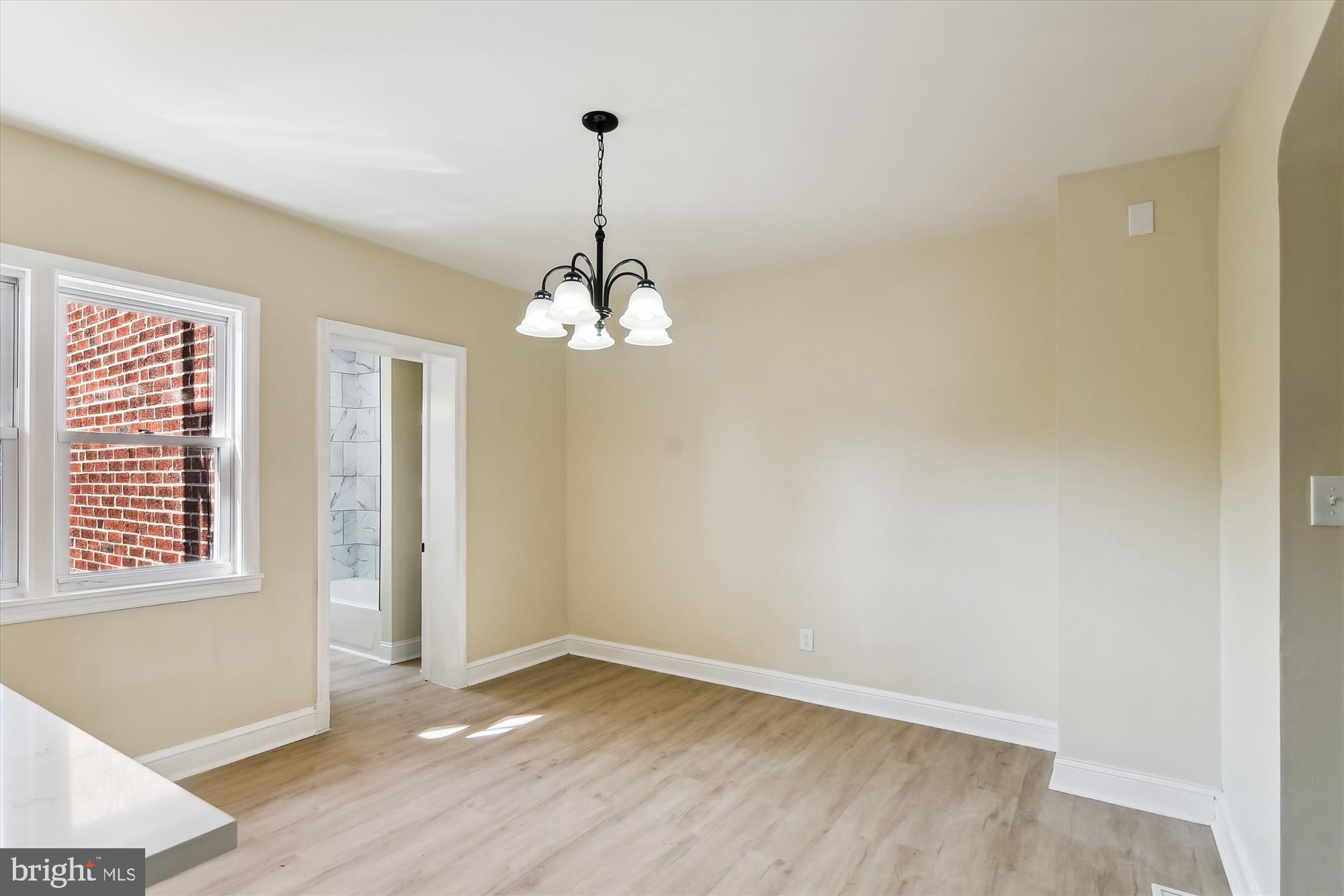 3312 Royce Avenue Baltimore, MD 21215 - Photo 10 of 20 a view of empty room with wooden floor fan and window