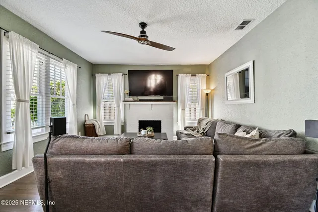 a kitchen with stainless steel appliances a stove a sink and a microwave