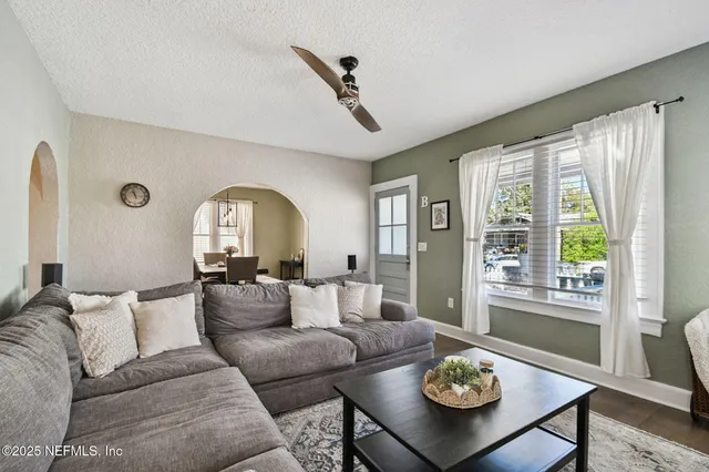 a kitchen with stainless steel appliances granite countertop a sink a stove and a microwave