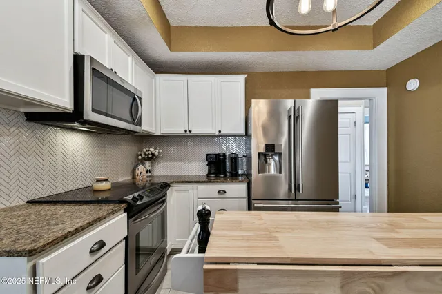 a view of a bedroom from a hallway