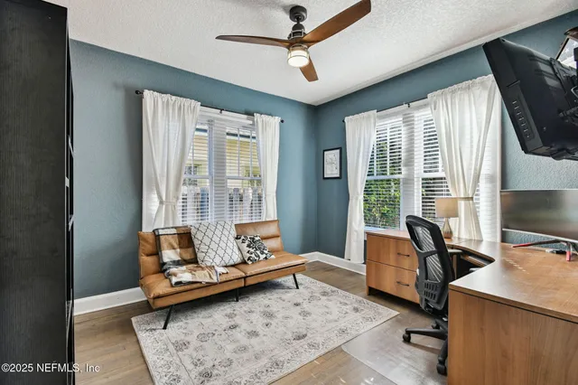 a backyard of a house with table and chairs