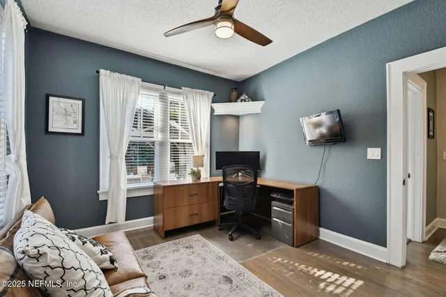 a view of a patio with furniture and a backyard