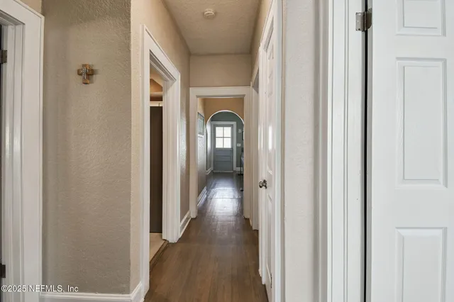 a view of parking space with cars parked