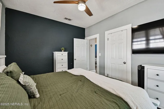 an aerial view of residential building with green space